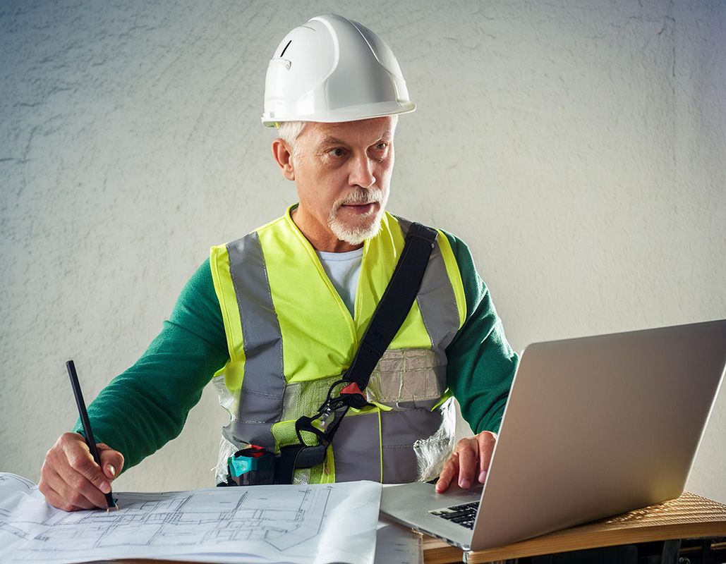 Surveyor doing time consuming computerwork